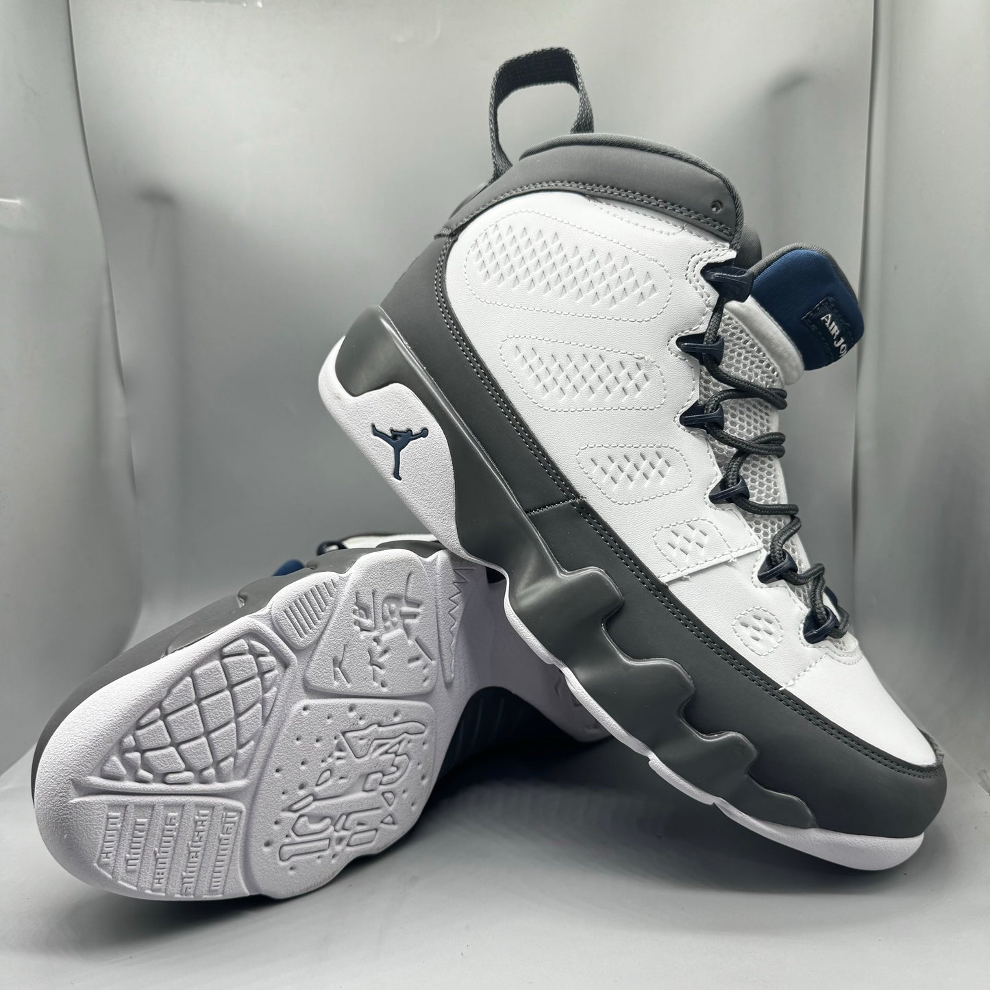 Air Jordan 9 Retro "Flint Grey" sneakers with white, French blue, and Flint grey colors