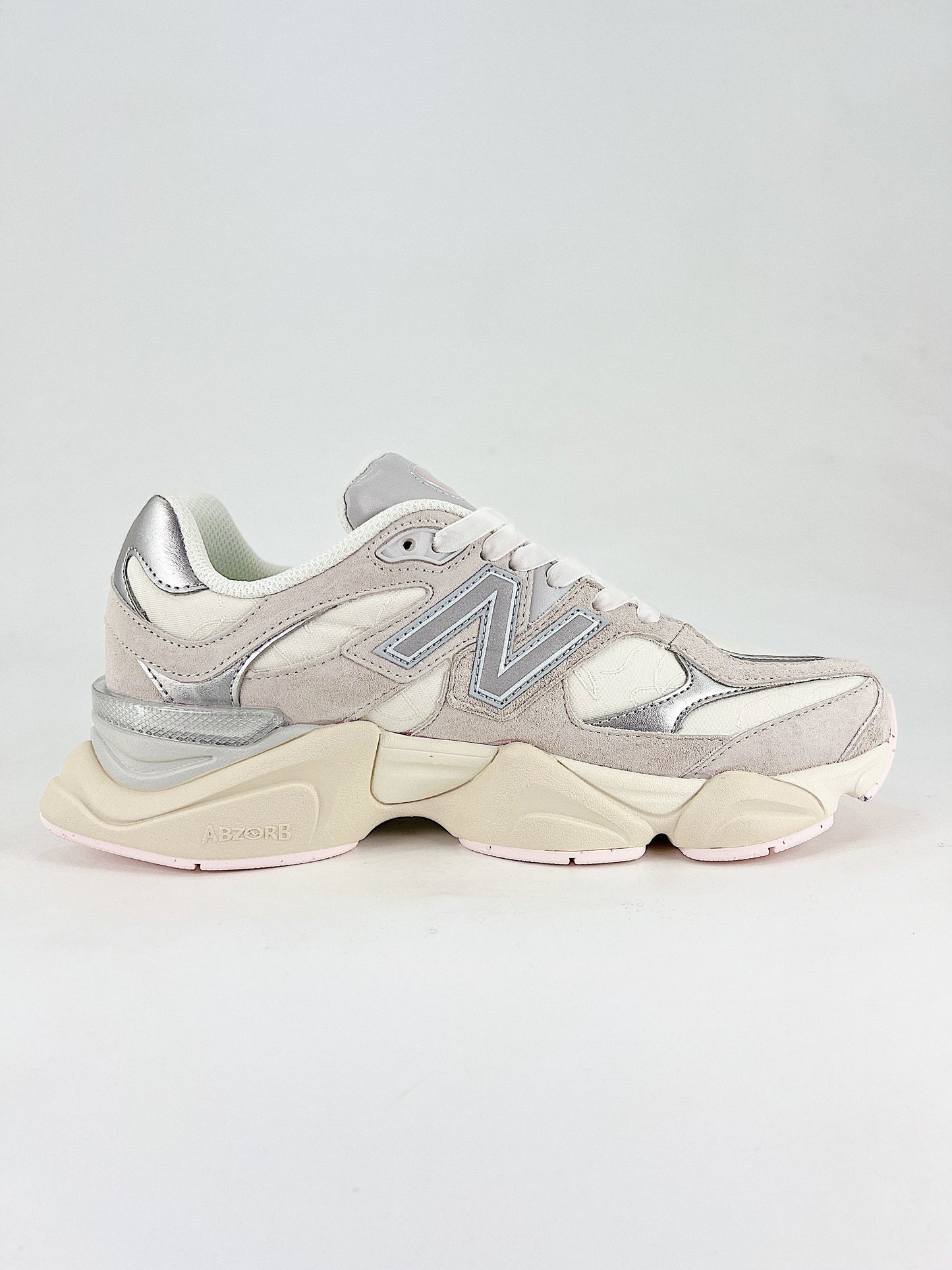 New Balance 9060 sneakers, featuring a retro-futuristic design inspired by archival models like the 990 serie