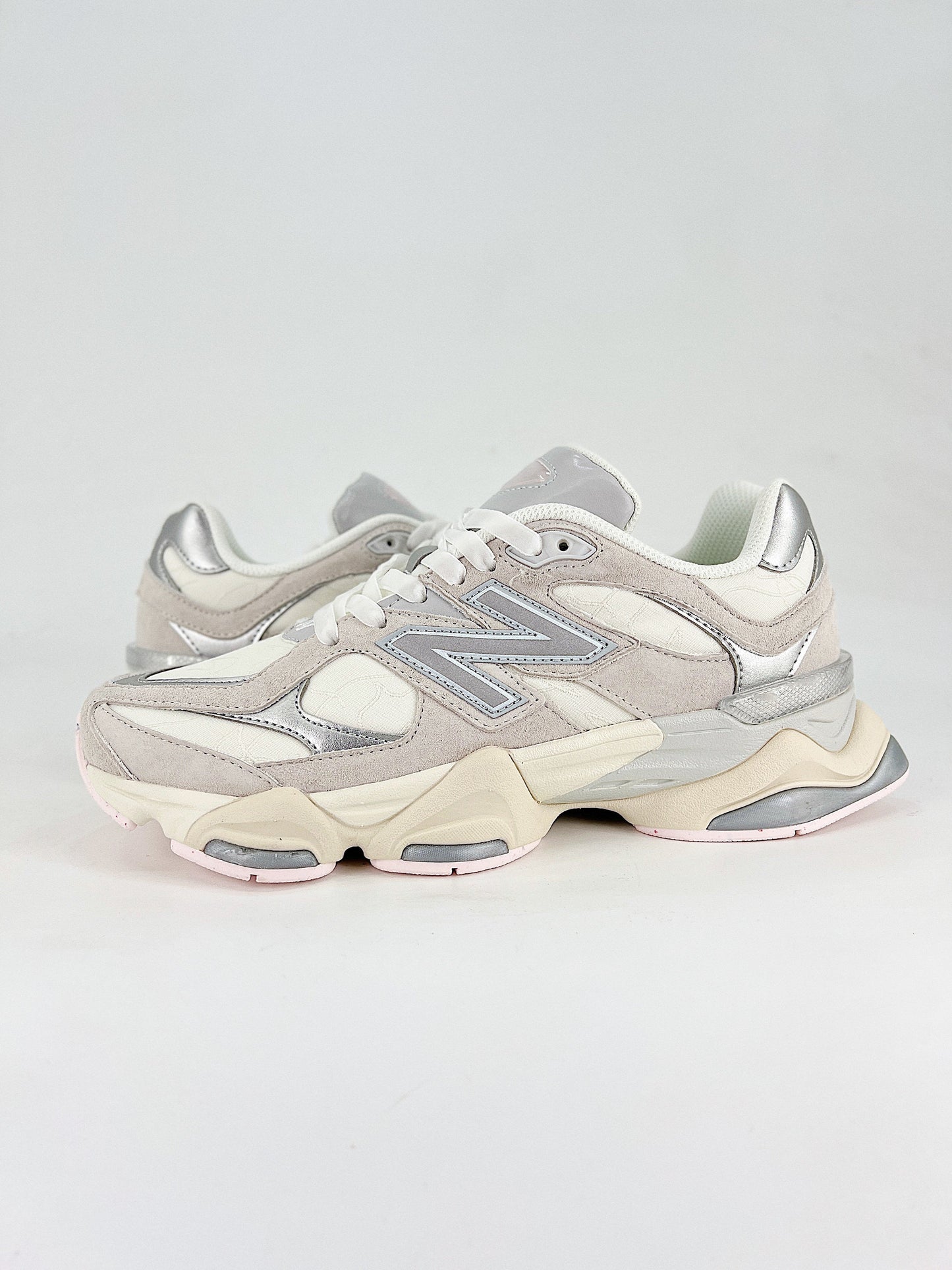 New Balance 9060 sneakers, featuring a retro-futuristic design inspired by archival models like the 990 serie