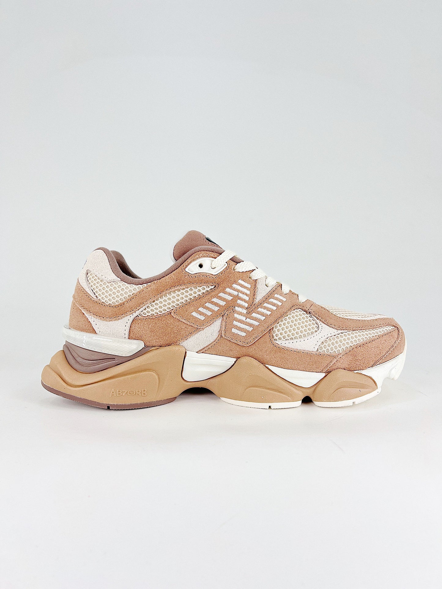 New Balance 9060 in the "Earth Shadow" or "Sparrow" colorway