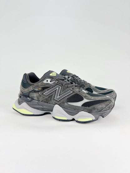 New Balance 9060 sneakers shown are in a black and cement colorway, often featuring a durable mesh and suede construction with Lime accents