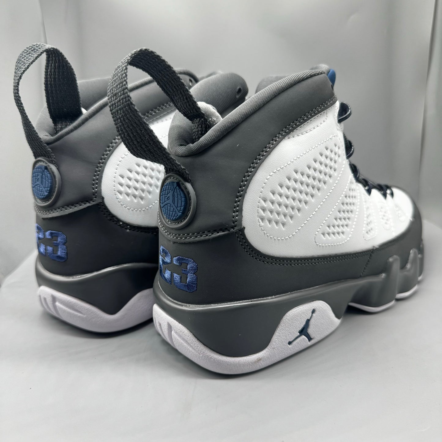 Air Jordan 9 Retro "Flint Grey" sneakers with white, French blue, and Flint grey colors