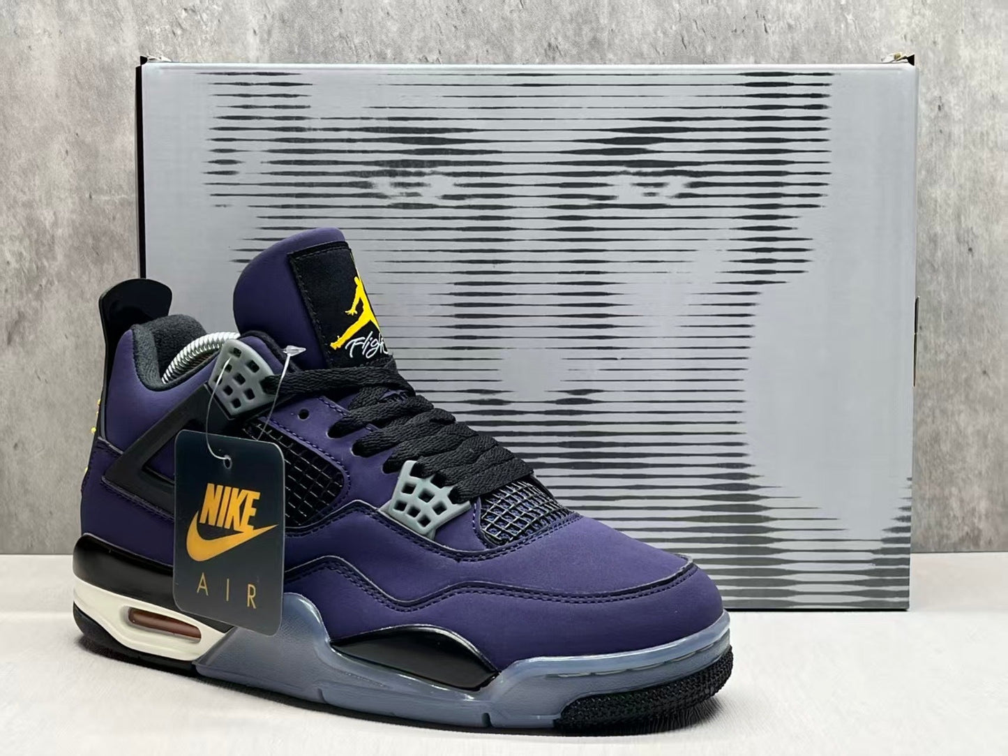 Air Jordan 4 Retro "Lakers" sneaker in an Imperial Purple nubuck upper with black and yellow accents