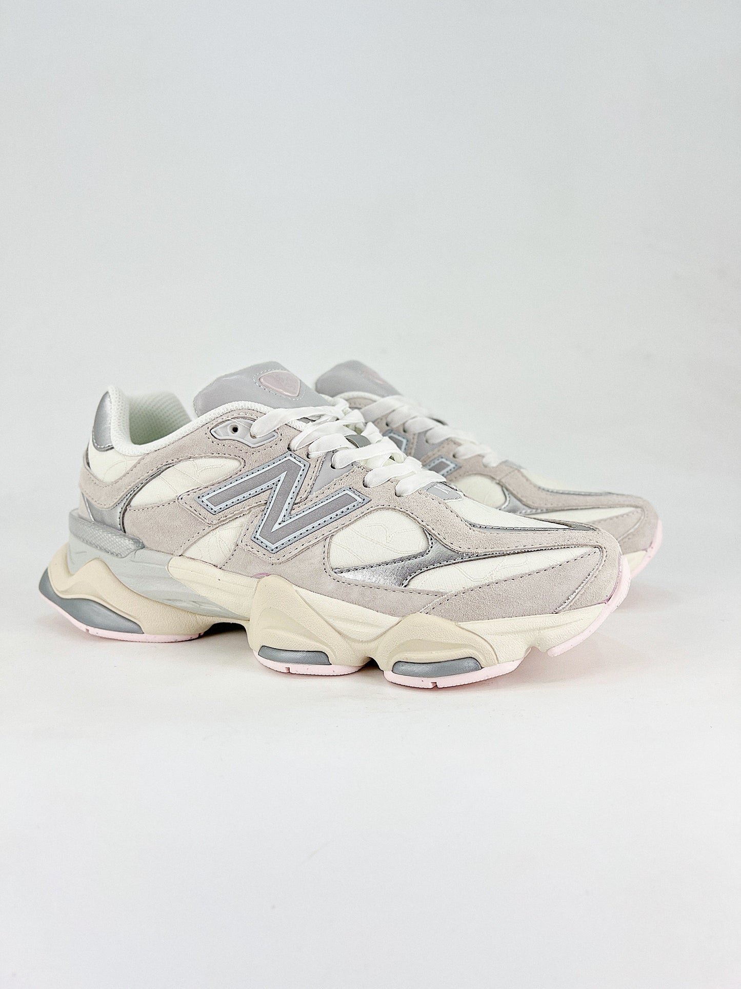 New Balance 9060 sneakers, featuring a retro-futuristic design inspired by archival models like the 990 serie