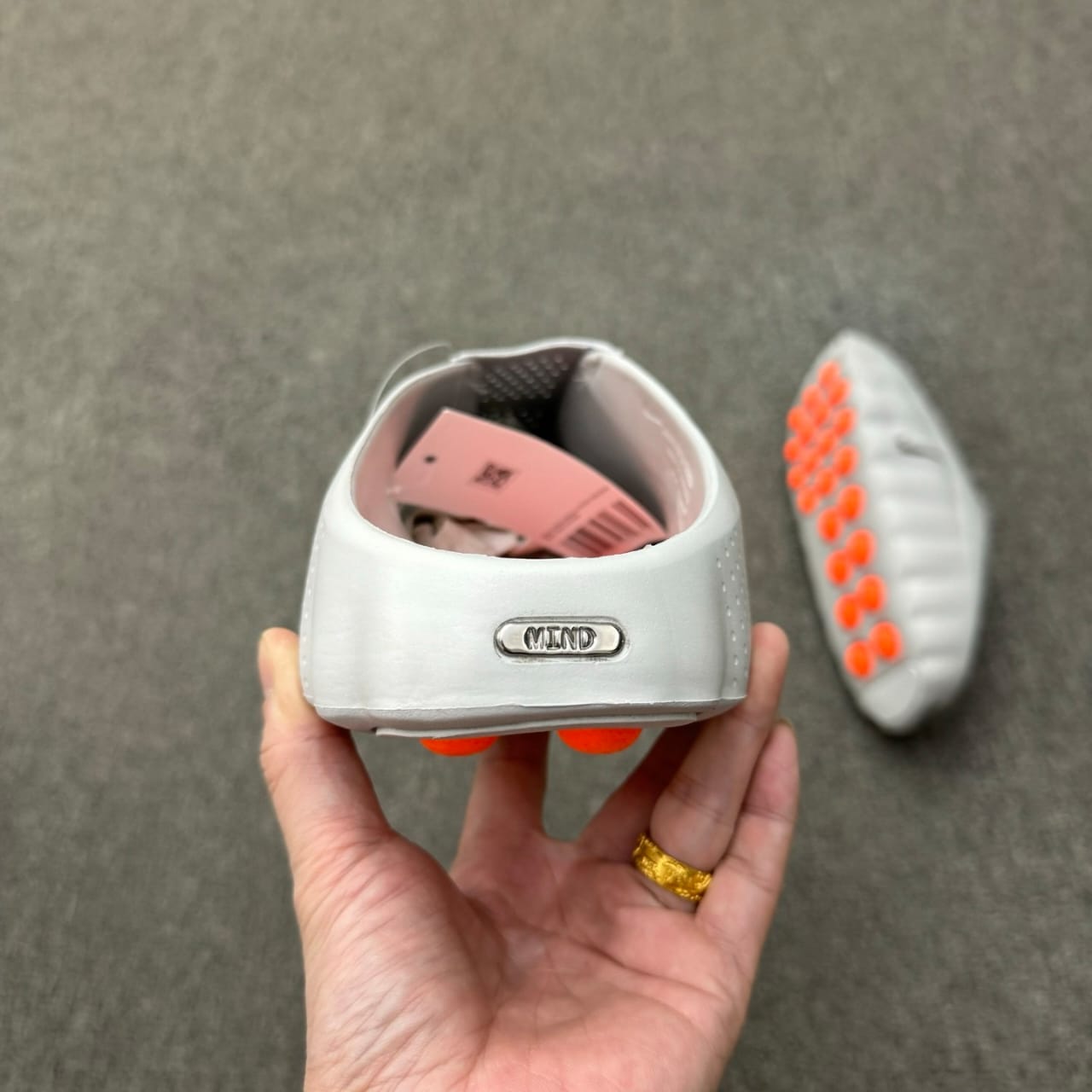 Nike Mind 001 recovery mule in the "Light Smoke Grey"
