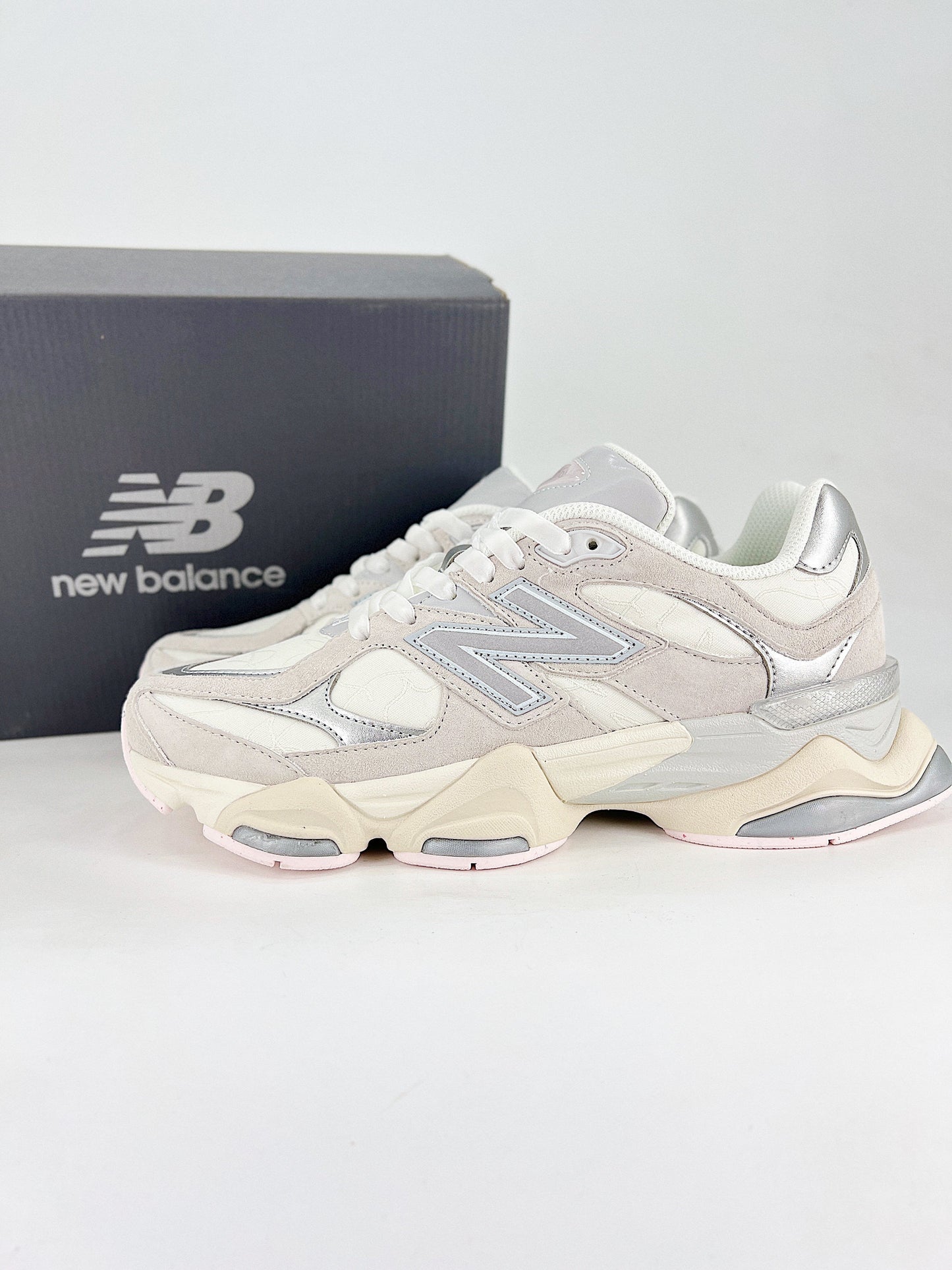 New Balance 9060 sneakers, featuring a retro-futuristic design inspired by archival models like the 990 serie