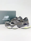 New Balance 9060 sneakers shown are in a black and cement colorway, often featuring a durable mesh and suede construction with Lime accents