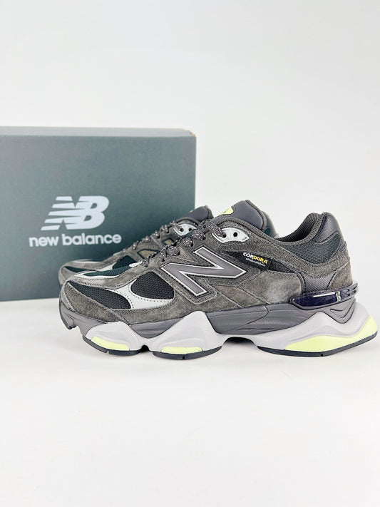 New Balance 9060 sneakers shown are in a black and cement colorway, often featuring a durable mesh and suede construction with Lime accents