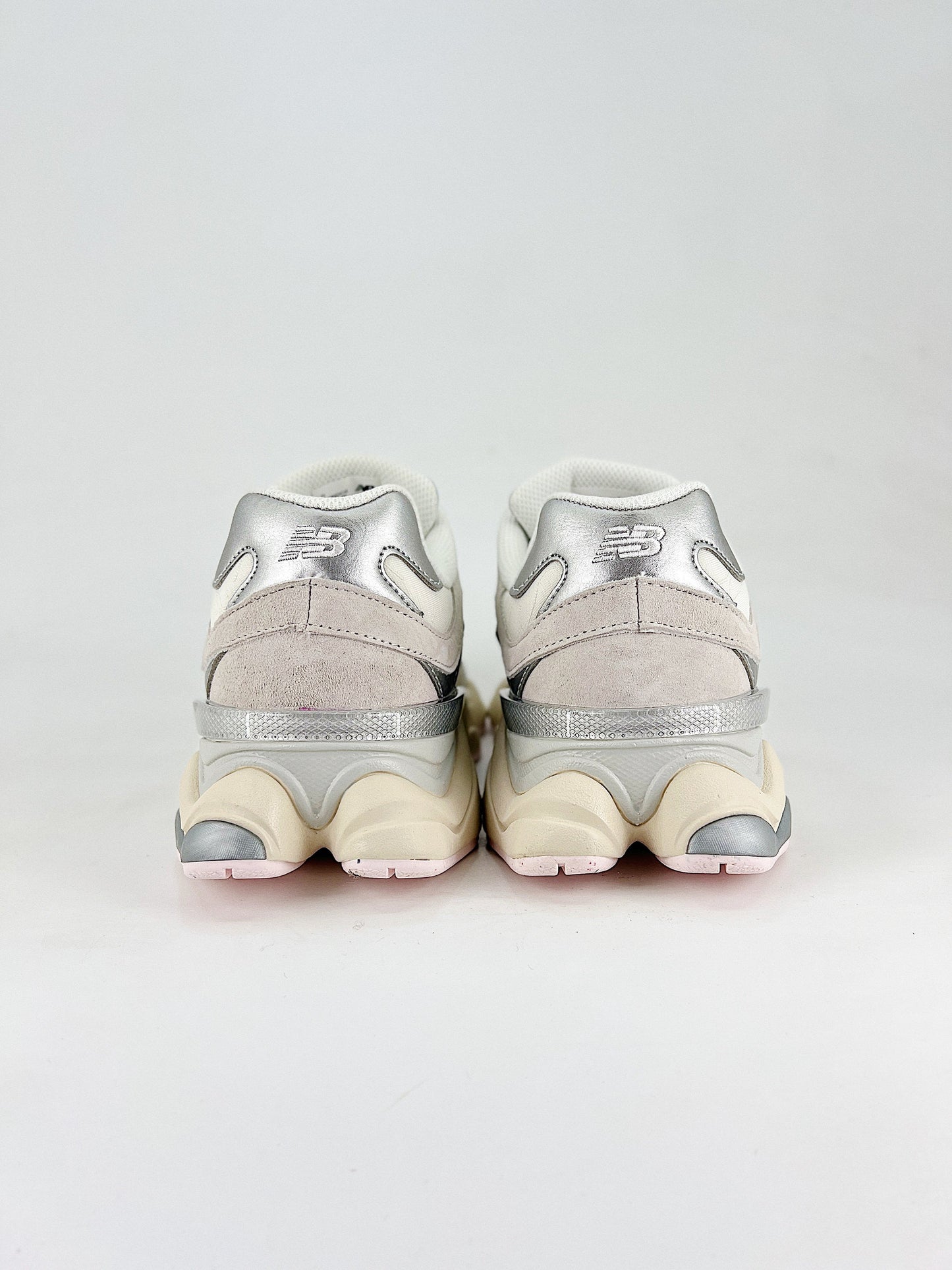 New Balance 9060 sneakers, featuring a retro-futuristic design inspired by archival models like the 990 serie