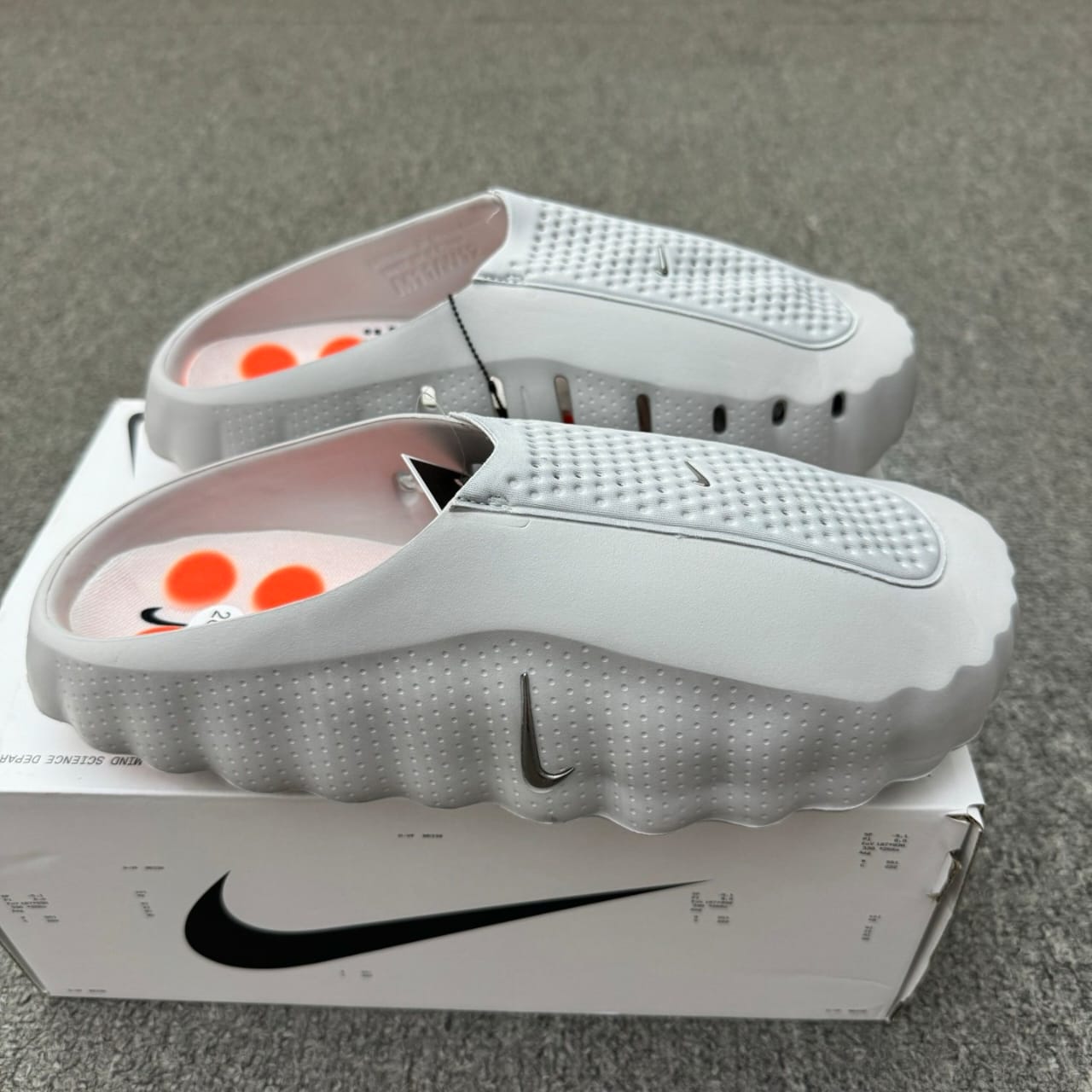Nike Mind 001 recovery mule in the "Light Smoke Grey"